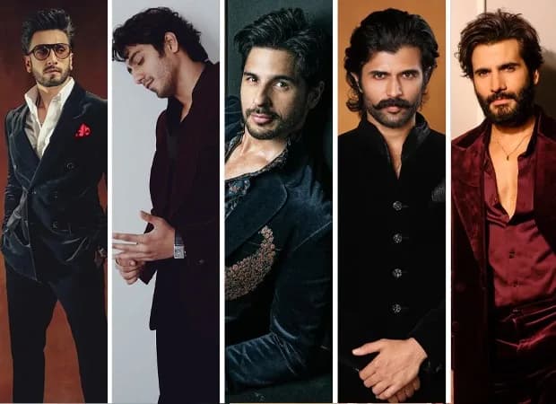 Ranveer Singh in a black velvet three-piece suit, standing in front of a mirror, adjusting his lapel.