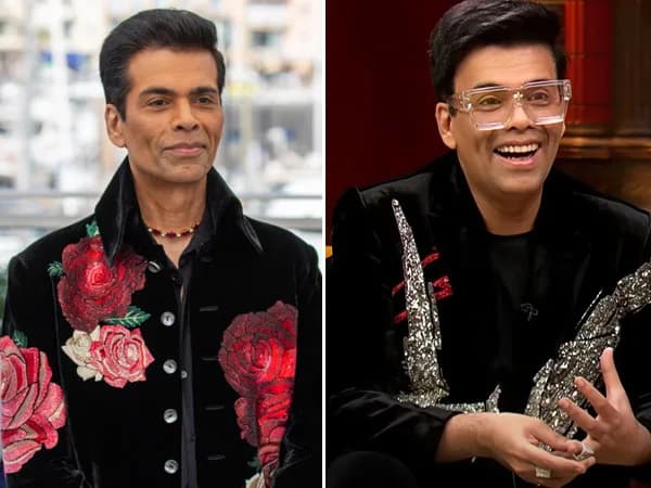 Karan Johar holding a coffee mug on the set of Koffee With Karan Season 9