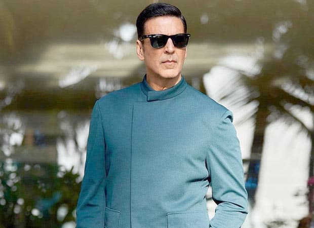 Akshay Kumar in a promotional still for Haiwaan, standing in a dimly lit, atmospheric setting ahead of the film's release.