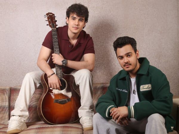 Abeer Pandit and Rohansh Pandit posing together at a music event related to Alpha