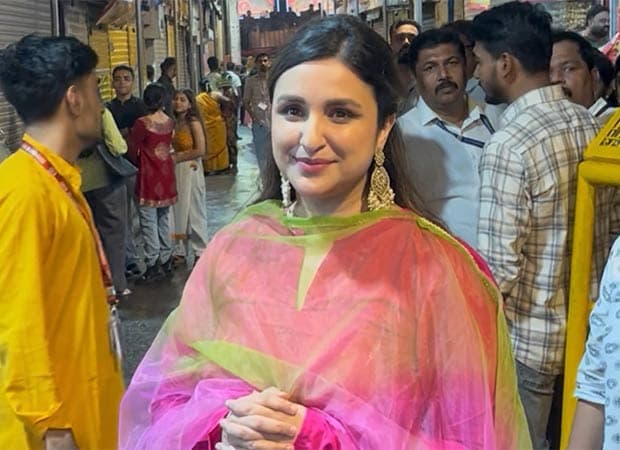 Parineeti Chopra in a pink ethnic outfit with statement earrings at the Lalbaugcha Raja pandal in Mumbai during Ganeshotsav.