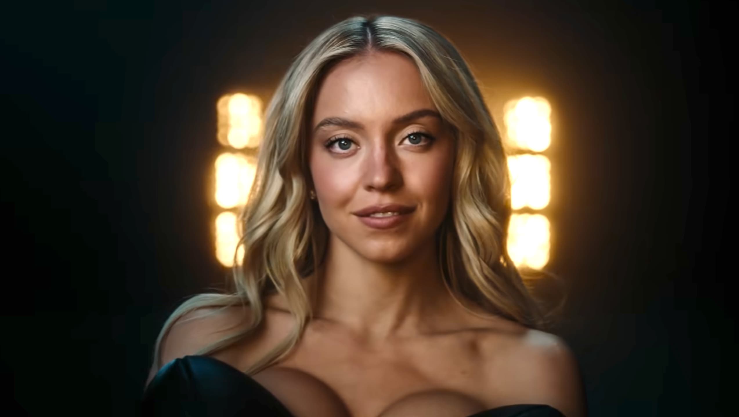 Sydney Sweeney in a promotional image for sports betting company Novig, covered by sports equipment including a football and tennis racket