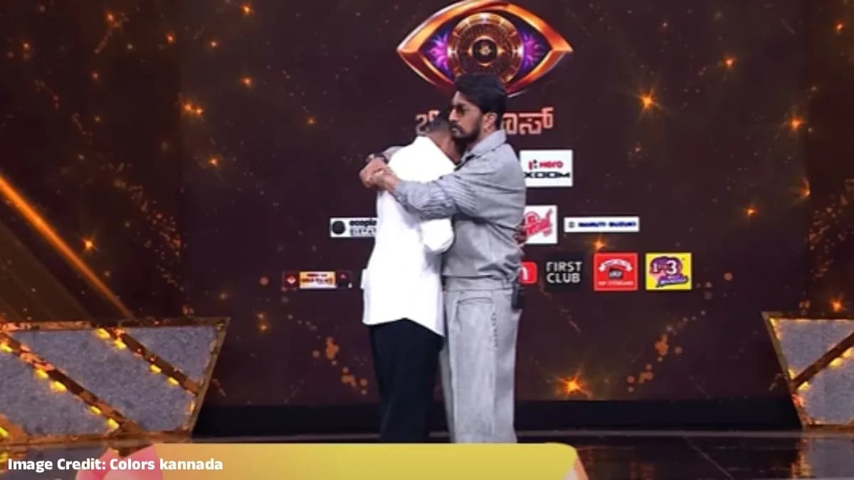 Sudeep holding Manju after his exit, both men looking solemn