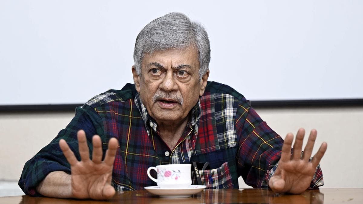 Veteran actor Anant Nag smiling in a portrait photo