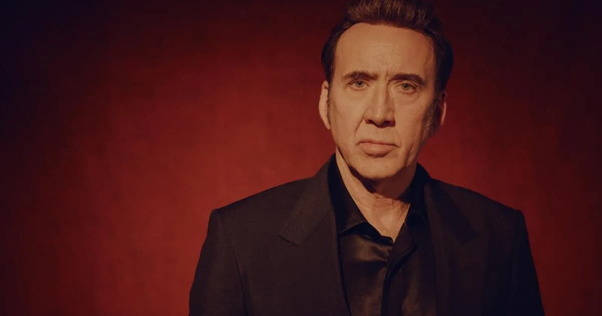 Nicolas Cage at Fan Expo Dallas, holding a Spider-Noir mask
