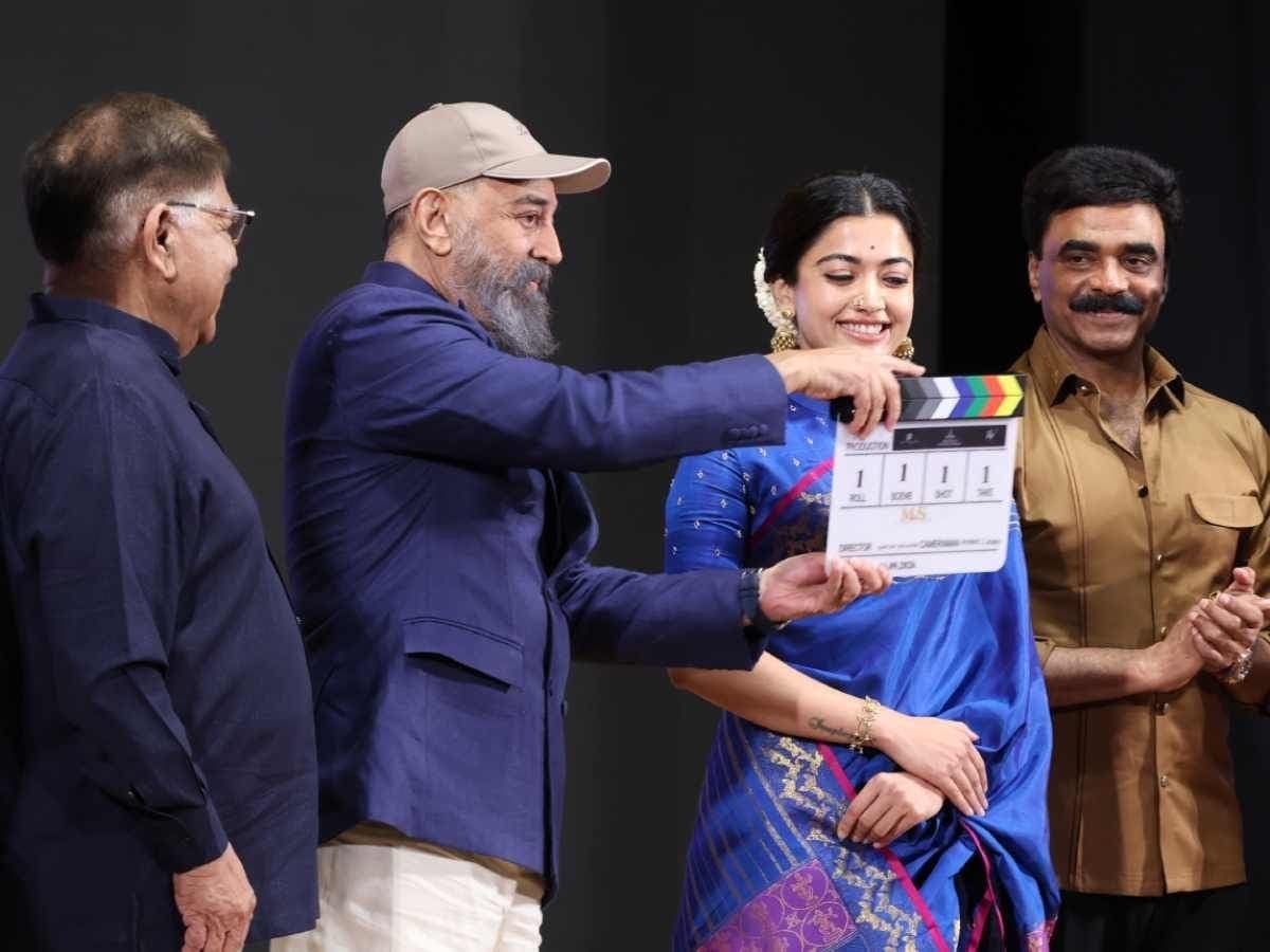 Kamal Haasan holding a clapperboard alongside Rashmika Mandanna at the launch event for the MS Subbulakshmi biopic in Chennai