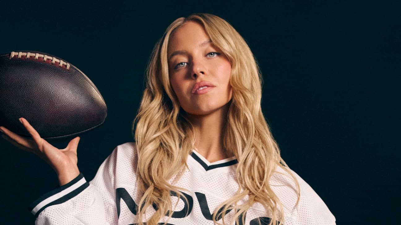 Sydney Sweeney poses covered by sports balls in a promotional image for the Novig sports trading app.