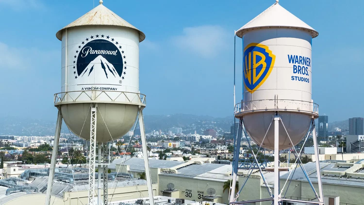 A stylized logo reading 'Skydance' with the words 'New Era' beneath it, overlaid on a split-screen image of the Warner Bros. and Paramount logos fading into each other.