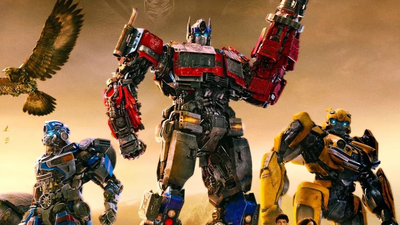 A stylised image of a Transformer robot standing over a city skyline, with a shadowy figure in a trench coat (resembling Spielberg) walking toward it.