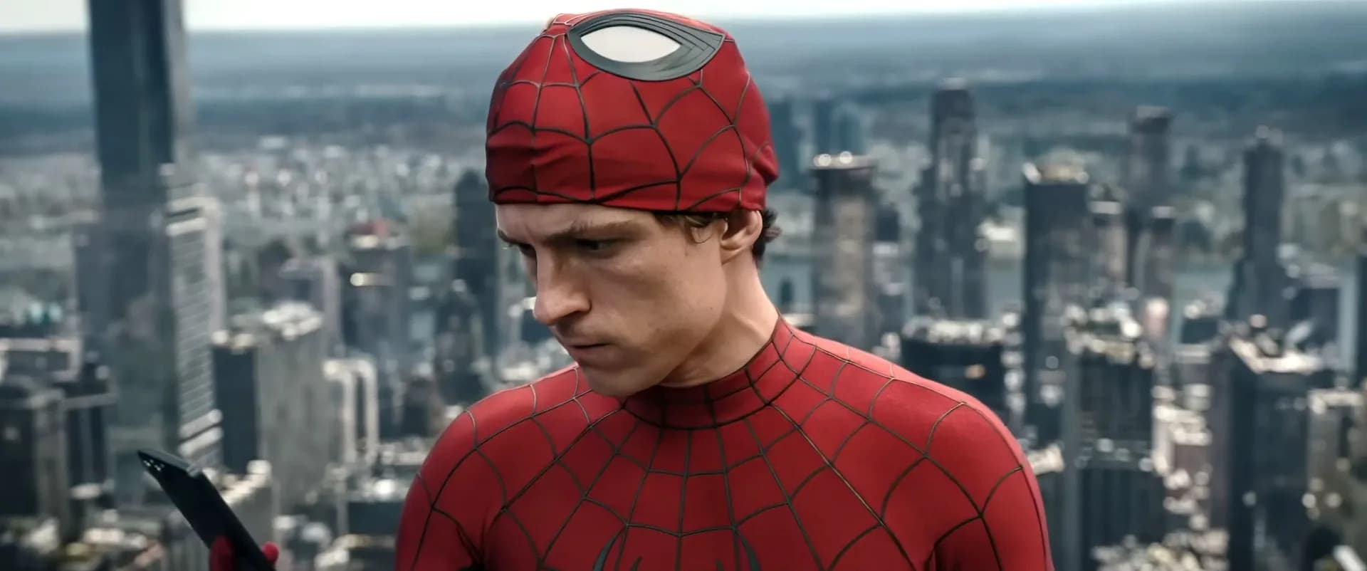 A crowded multiplex marquee lit up with summer 2026 blockbuster titles including Spider-Man: Brand New Day and The Odyssey.