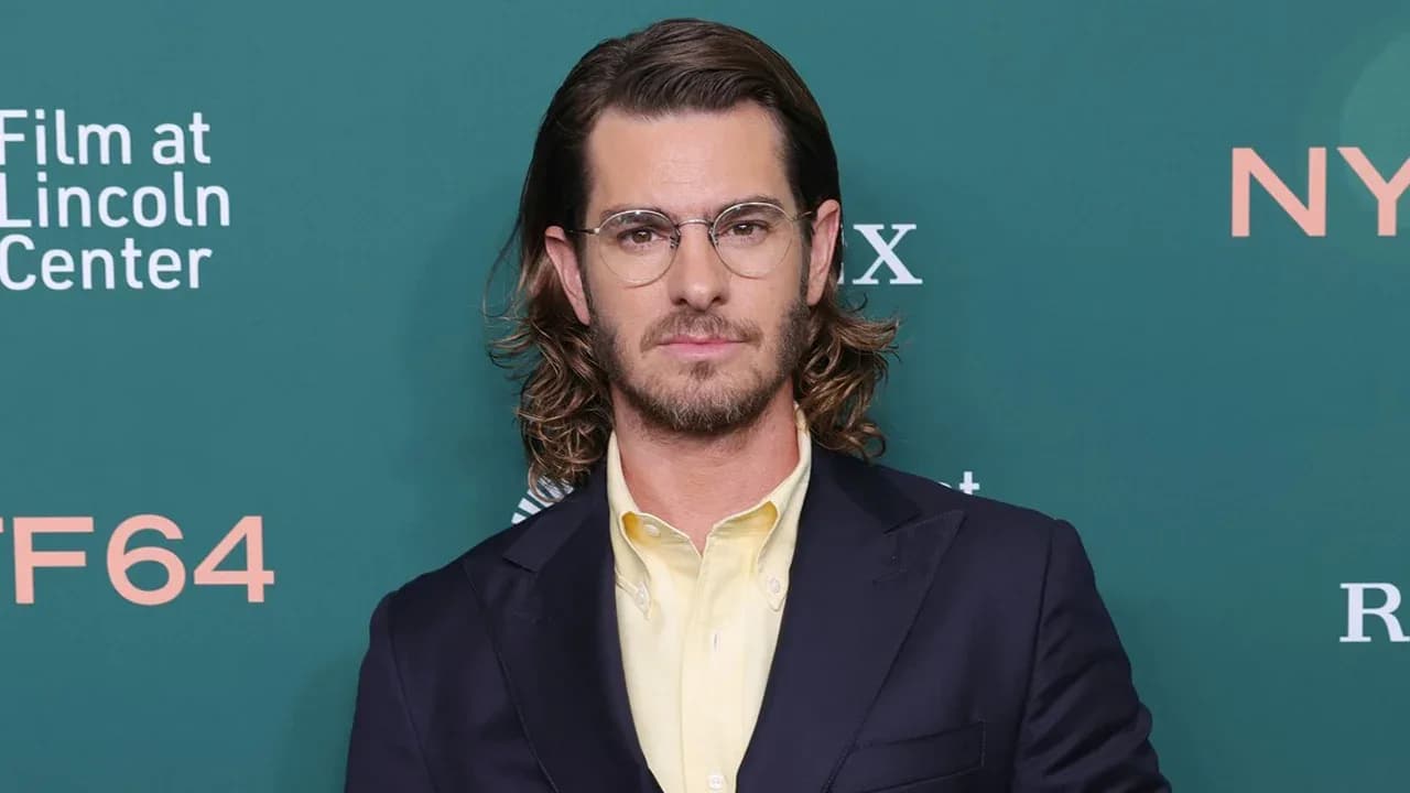 Andrew Garfield at the premiere of Artificial, wearing a J. Press suit and Jaeger-LeCoultre watch.