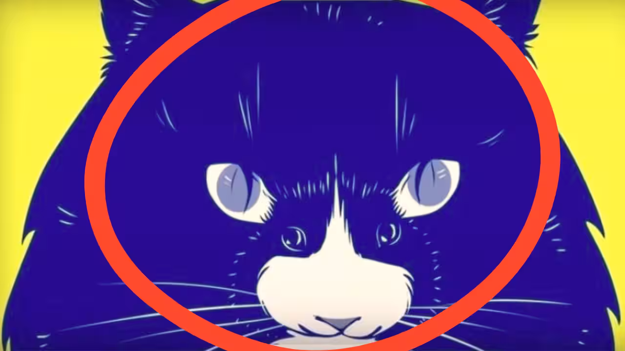 A blue cat in the foreground with a hidden mouse blended into the background pattern