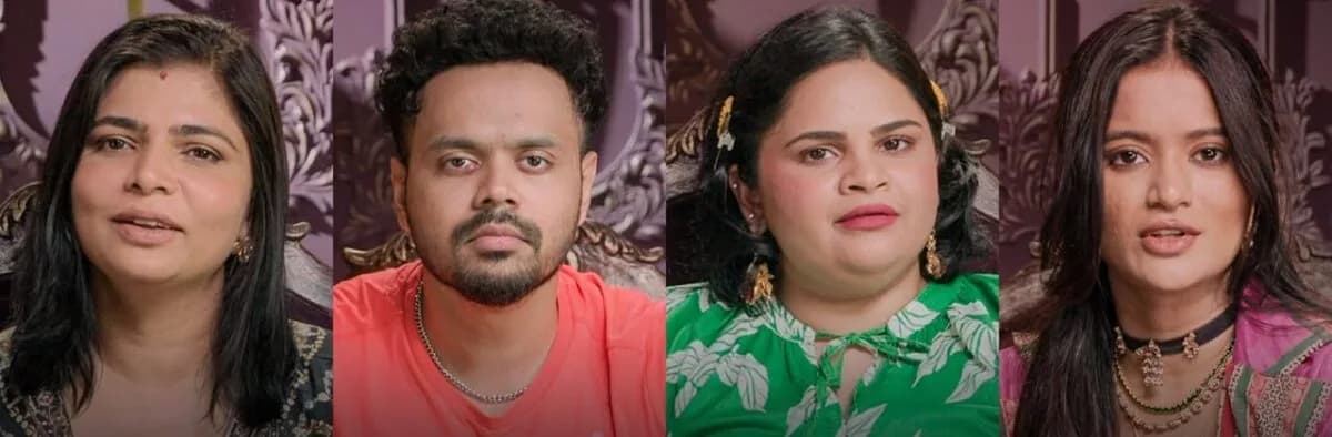 Close-up of a contestant in The Traitors Telugu looking tense during a confrontation in a dimly lit room, surrounded by others in dramatic poses.