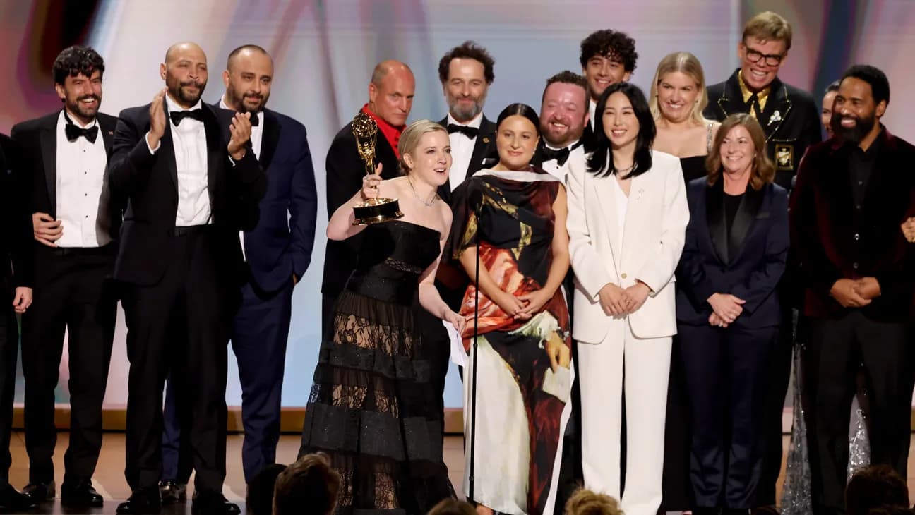 Cast members of Widow's Bay holding their Emmy trophies on stage at the 2026 Primetime Emmy Awards.