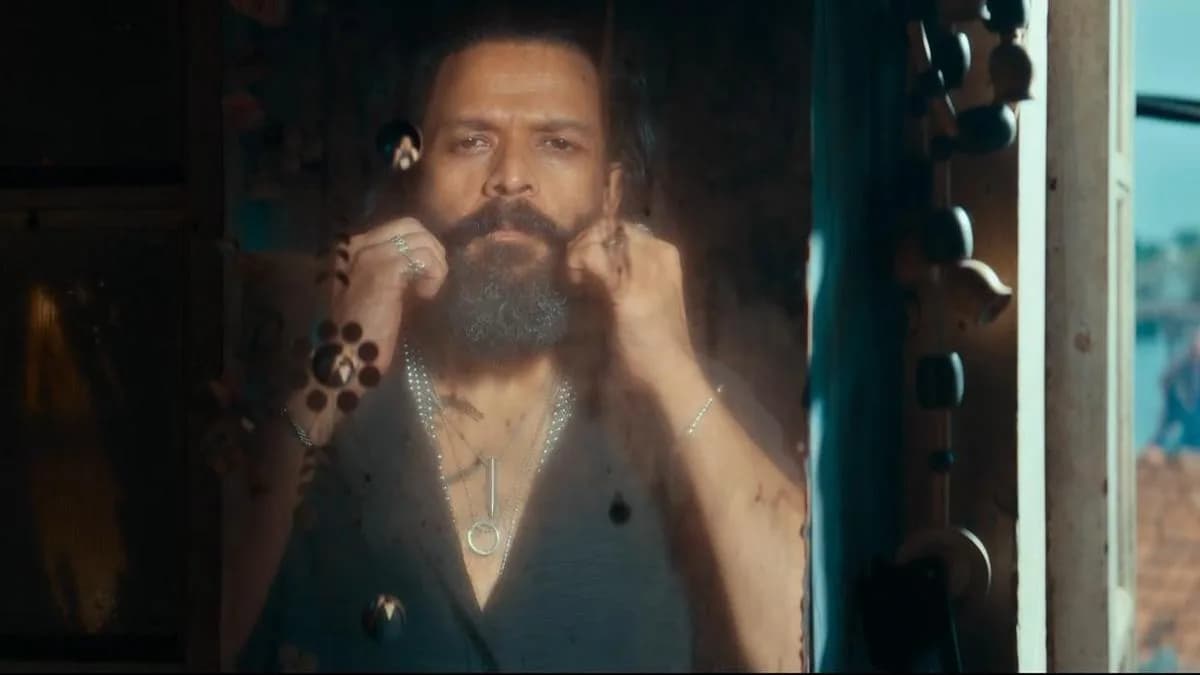 Jayasurya and Vinayakan in action-packed scenes from the Titans trailer, set against a surreal backdrop with dramatic lighting.